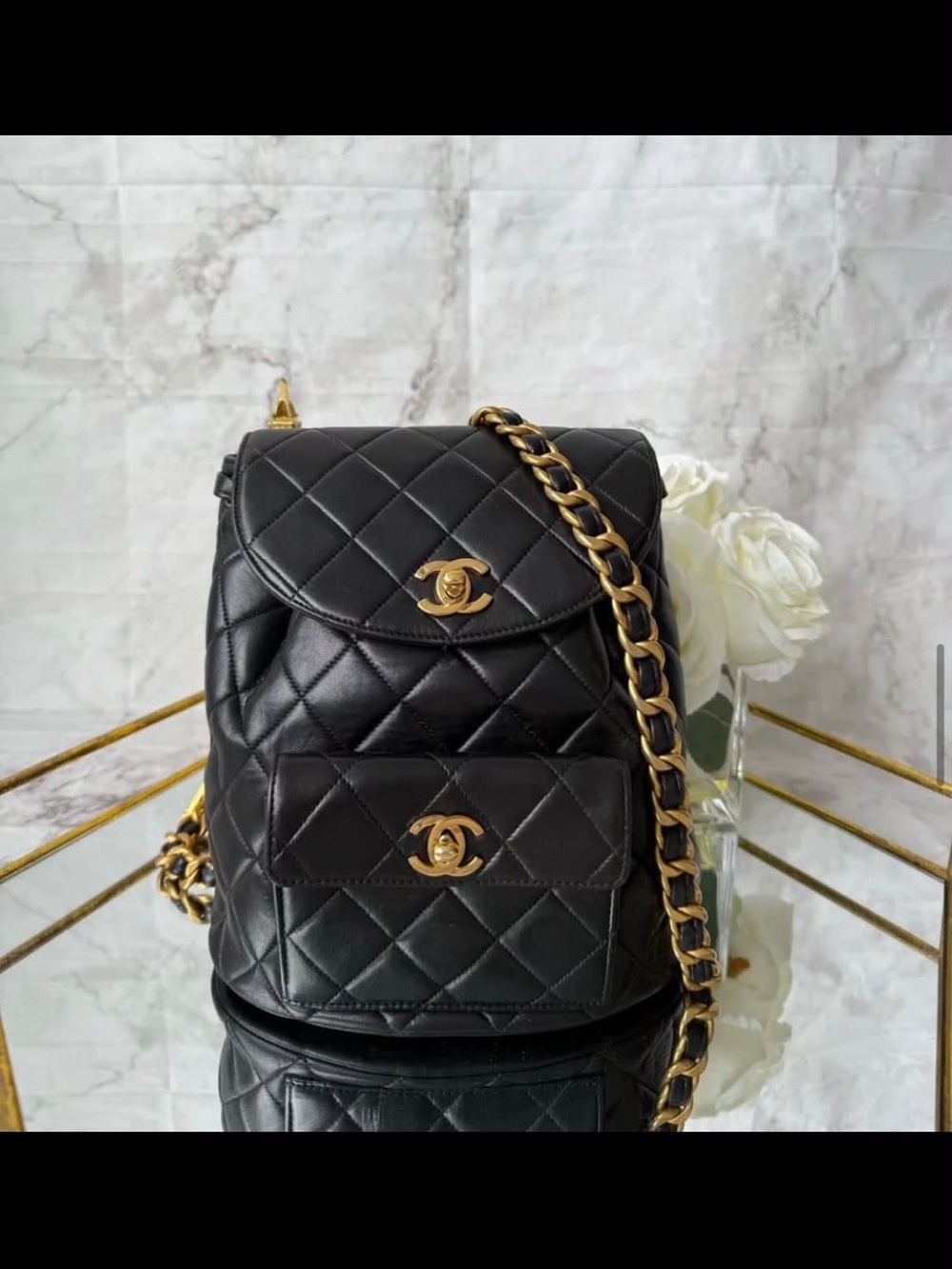 CHANEL Black Quilted Lambskin Backpack with Gold Chain Detail